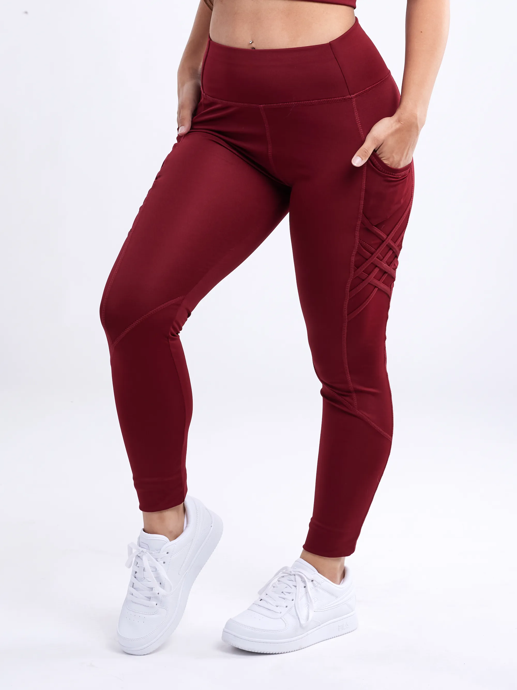 Hochtaillierte Criss-Cross-Trainingsleggings mit Hüfttaschen