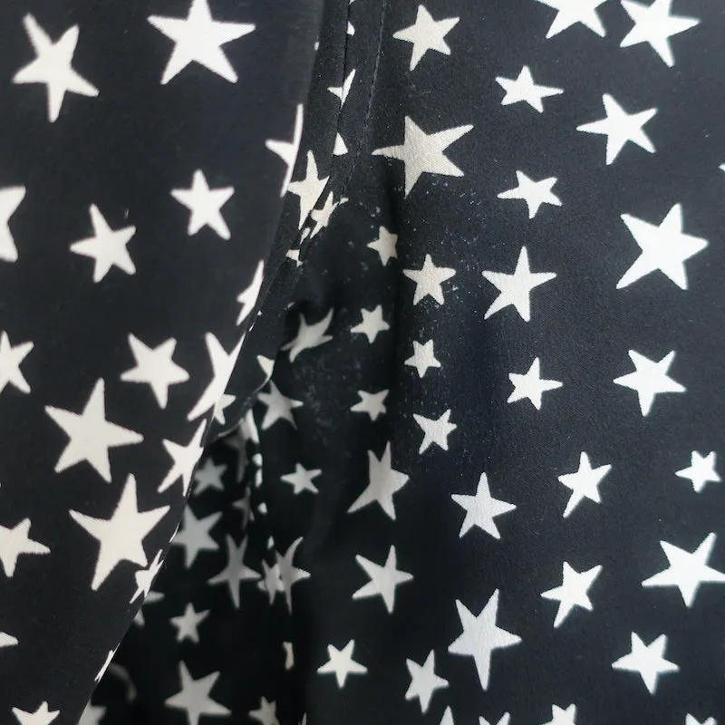 Saint Laurent Sternmuster Seidenbluse Schwarz/Weiß Größe 42 Langarmbluse